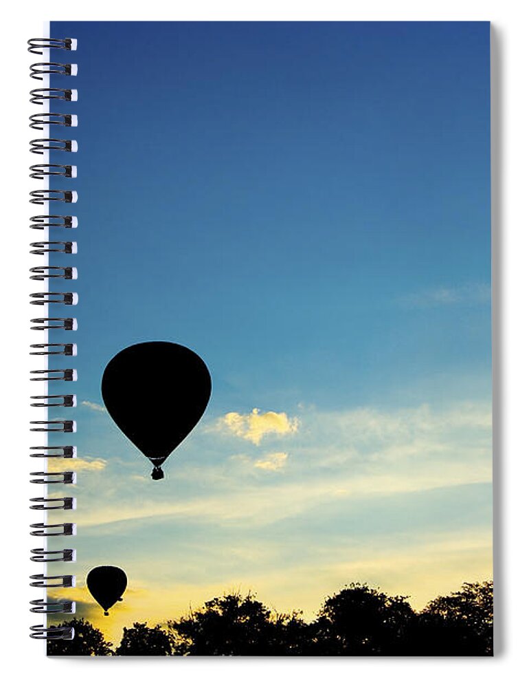Hot Spiral Notebook featuring the photograph Floating in the air at sundown by Peter Lloyd