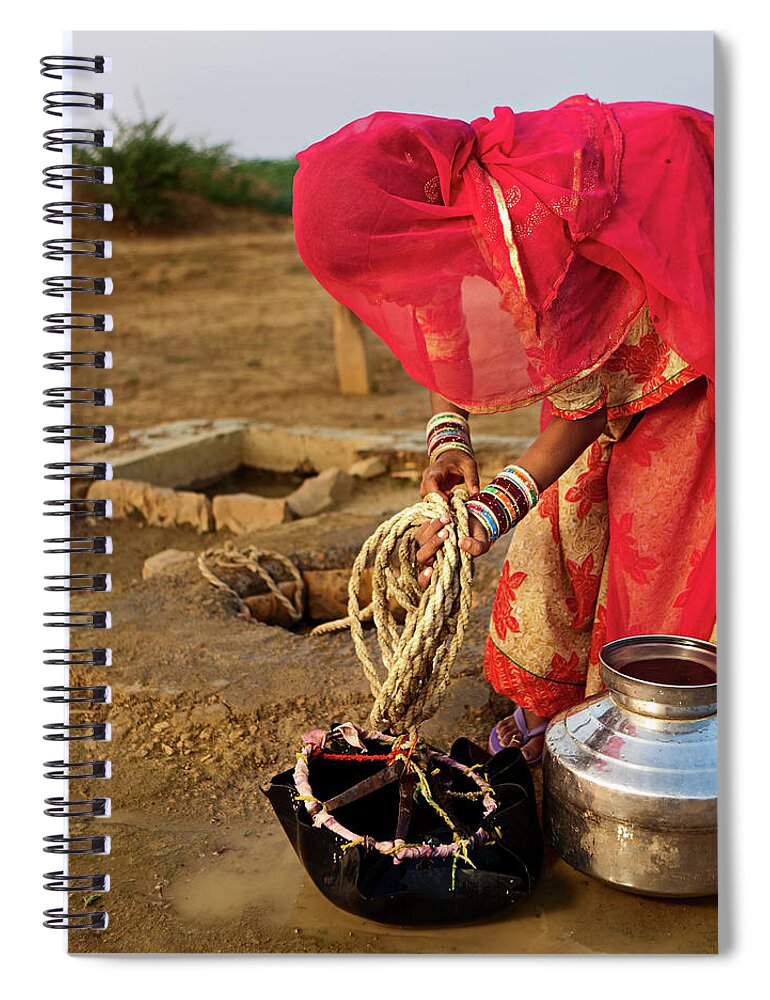 Working Spiral Notebook featuring the photograph Indian Woman Getting Water From The by Hadynyah