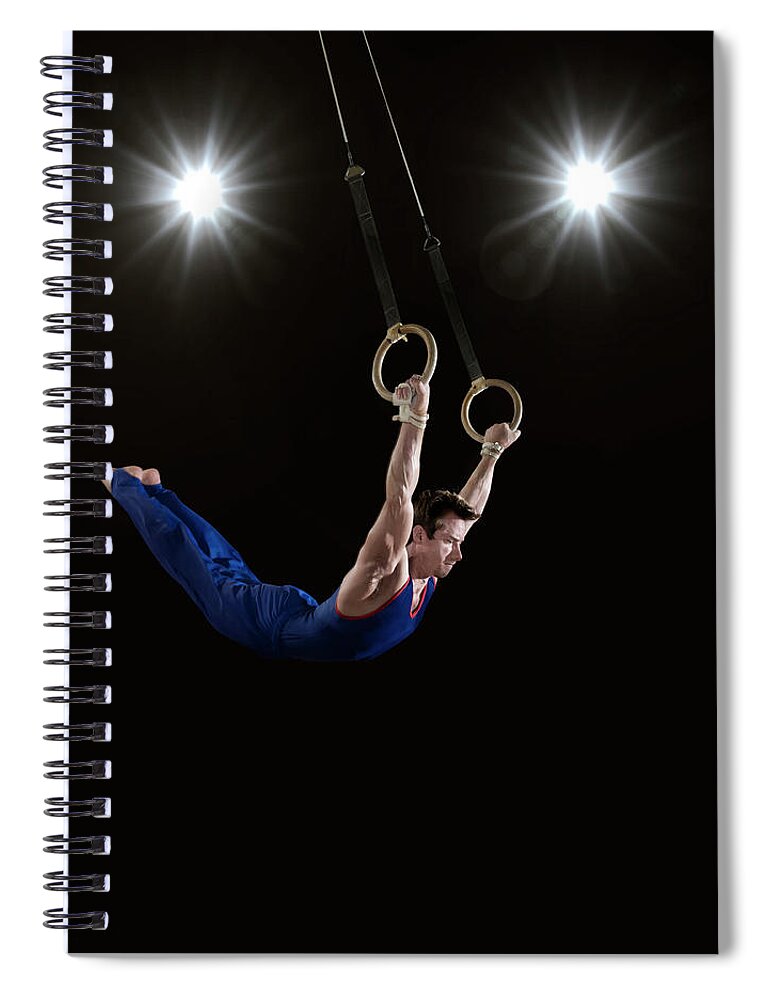 Expertise Spiral Notebook featuring the photograph Male Gymnast On Rings by Mike Harrington