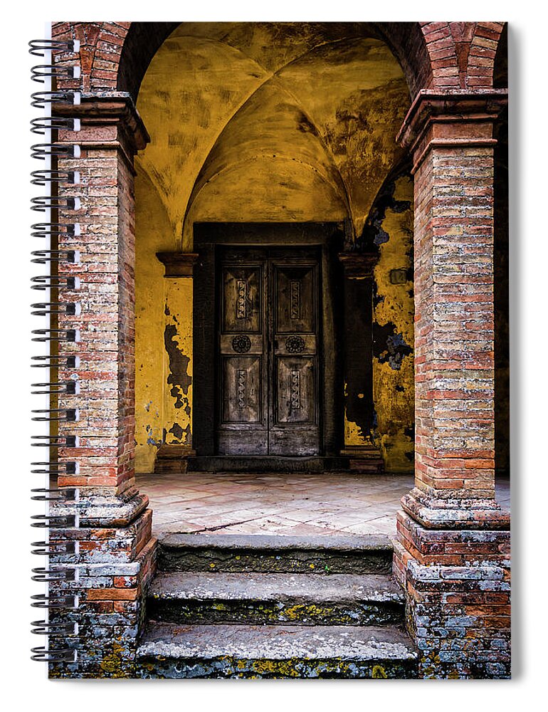 Arch Spiral Notebook featuring the photograph Old Decorated Wooden Door In A Ghost by Ardenvis