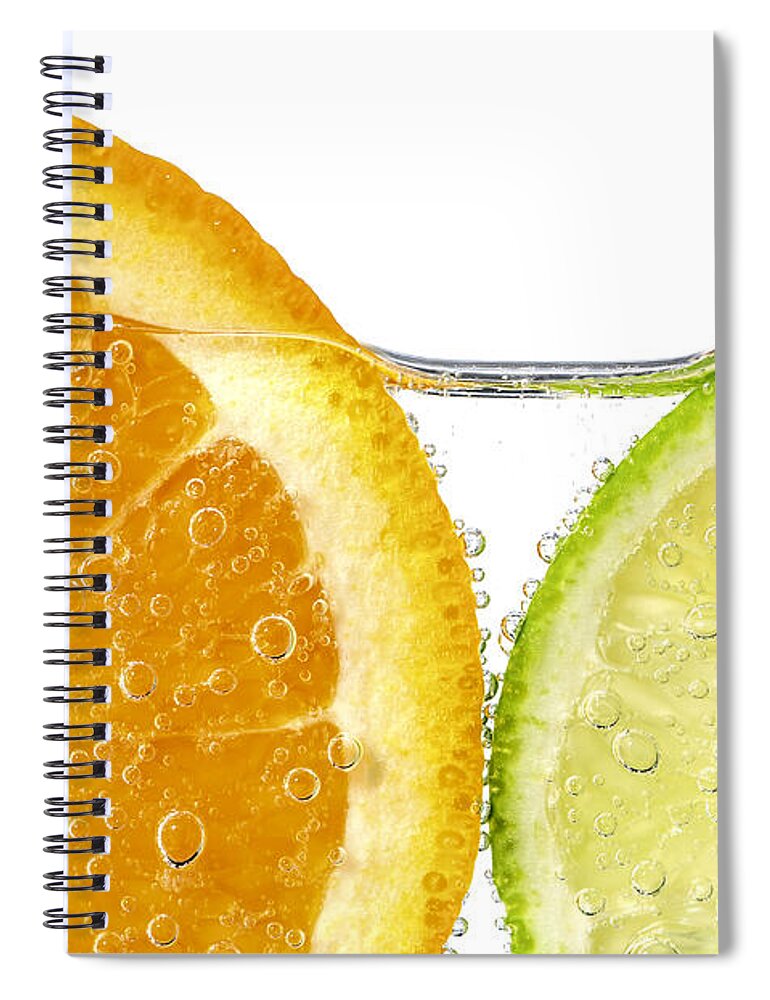Orange Spiral Notebook featuring the photograph Orange and lime slices in water by Elena Elisseeva