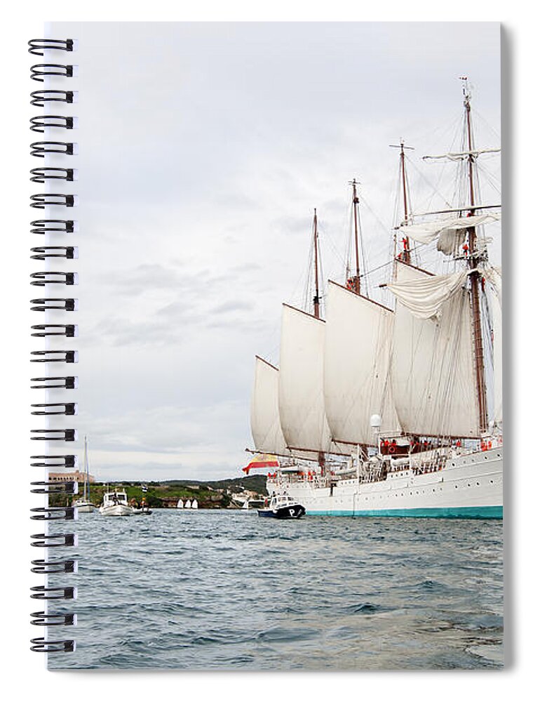 Bay Spiral Notebook featuring the photograph Juan Sebastian de Elcano famous tall ship of Spanish navy visits Port Mahon in front of bloody islan by Pedro Cardona Llambias