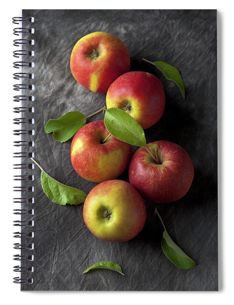 Five Objects Spiral Notebook featuring the photograph Red Apples With Leaves On Black by Westend61