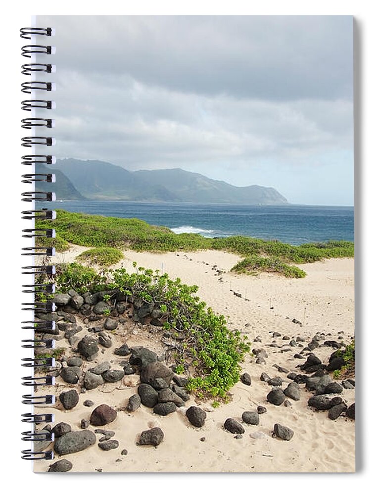 Honolulu Spiral Notebook featuring the photograph Rocks And Greenery In The Sand Leading by Brandon Tabiolo / Design Pics