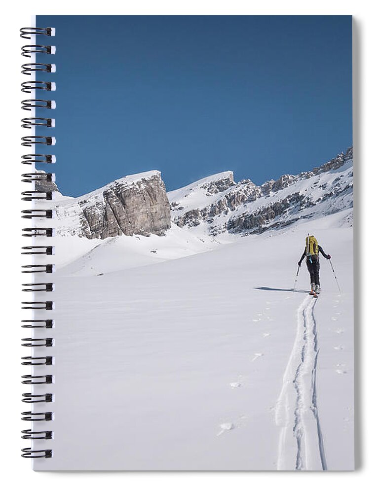 Scenics Spiral Notebook featuring the photograph Skier Lays New Track Across Snowslope by Ascent Xmedia