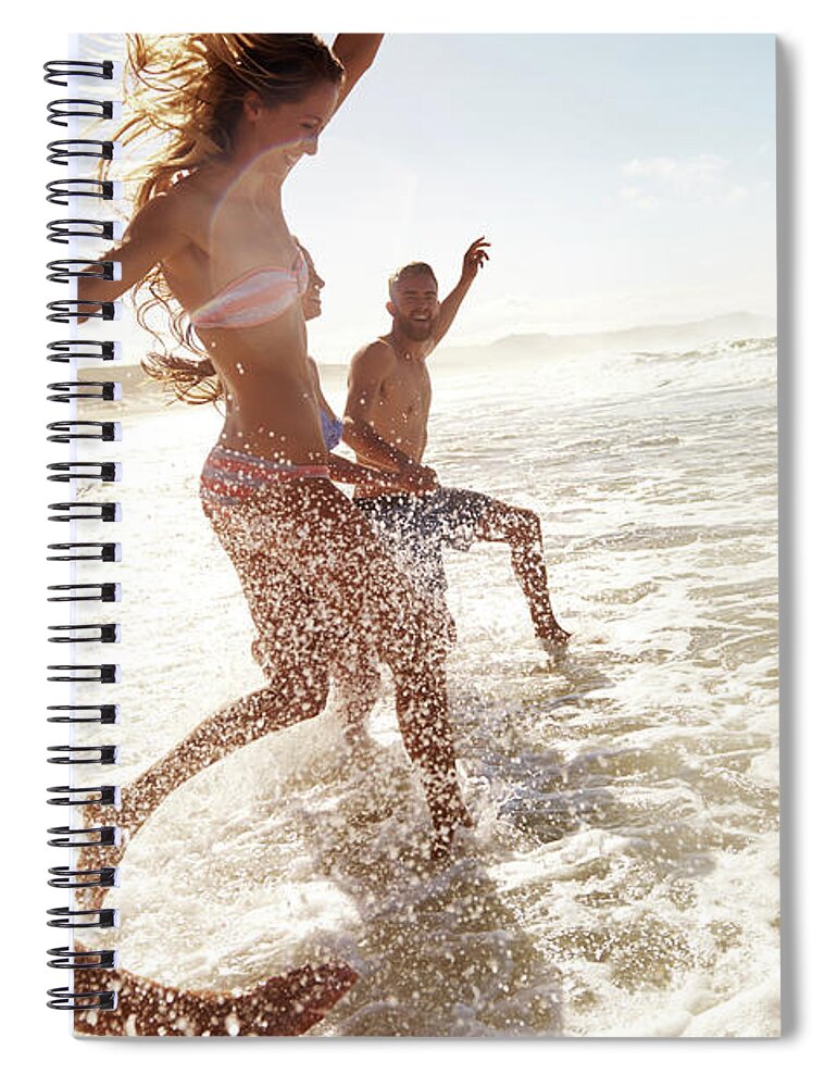 Young Men Spiral Notebook featuring the photograph Splashing Through The Waves by Pixdeluxe