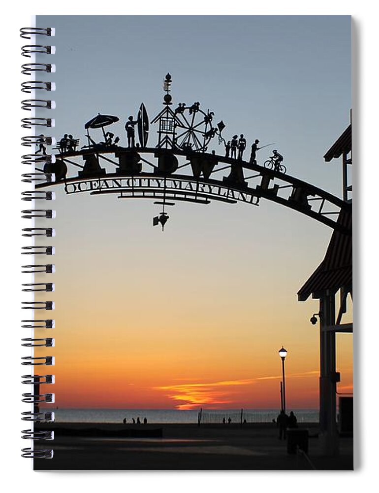 Sunrise Spiral Notebook featuring the photograph Sun Reflecting on Clouds Ocean City Boardwalk Arch by Robert Banach