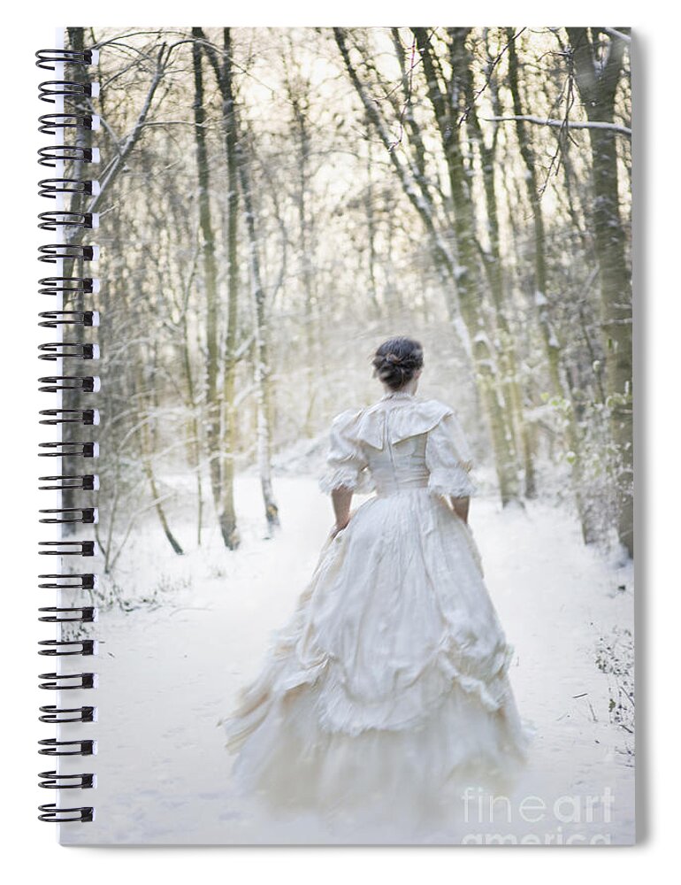 Woman Spiral Notebook featuring the photograph Victorian Woman Running Through A Winter Woodland With Fallen Sn by Lee Avison