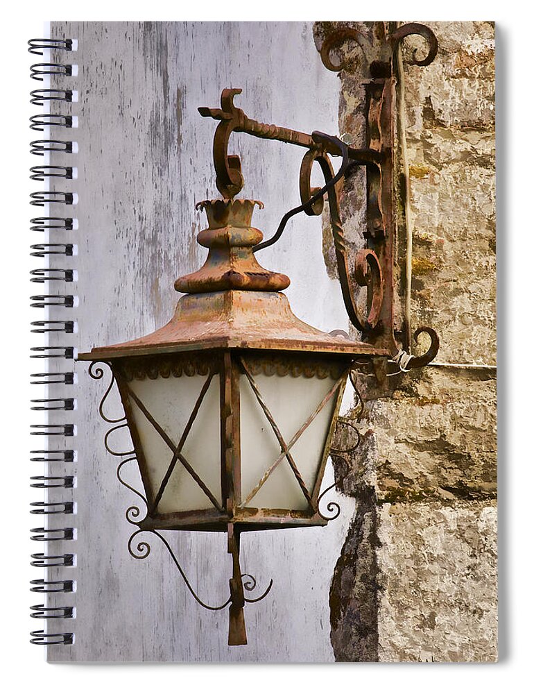 Obidos Spiral Notebook featuring the photograph Weathered Wrought Iron Street Lamp of Medieval Europe by David Letts