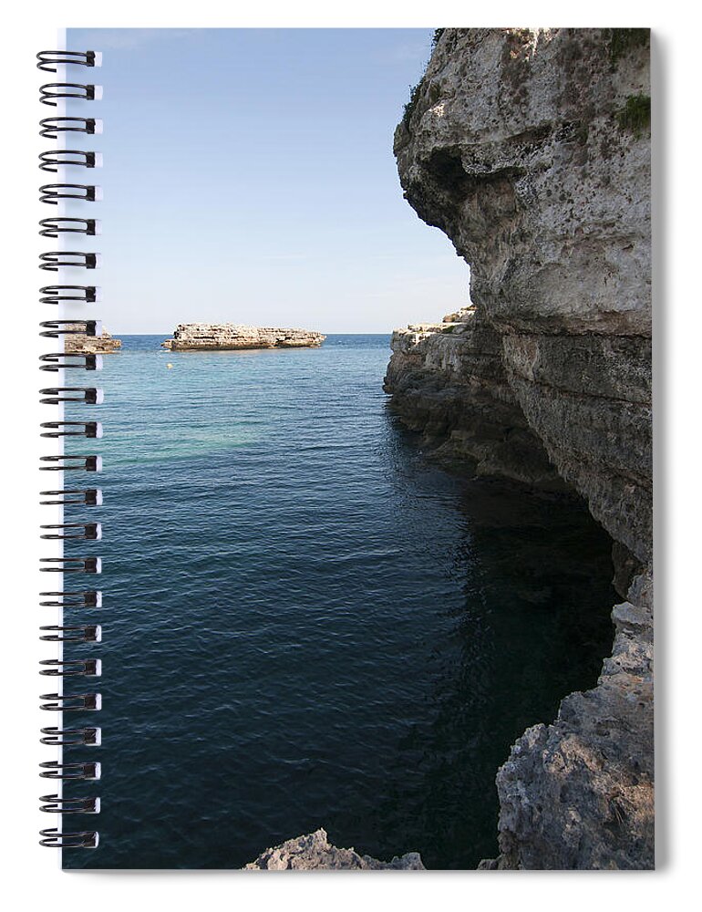 20-24 Spiral Notebook featuring the photograph Minorca south coast rocks in Alcafar beach rounded with a turquoise mediterranean sea - White rocks by Pedro Cardona Llambias