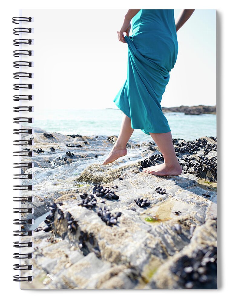 People Spiral Notebook featuring the photograph Woman Walking Over Coastal Rocks by Dougal Waters