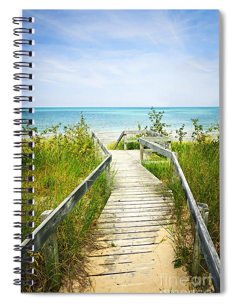 Beach Spiral Notebook featuring the photograph Wooden walkway over dunes at beach by Elena Elisseeva