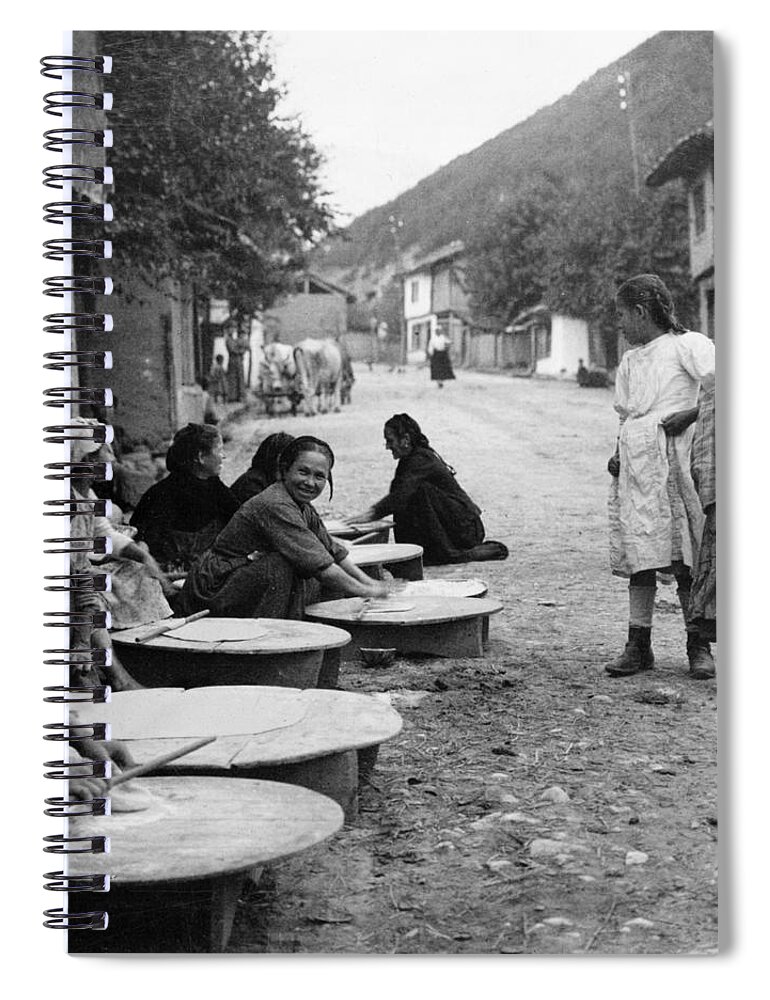 Berkovitsa Spiral Notebook featuring the photograph Berkovitsa Bulgaria - Women making bread in the streets - c 1911 by International Images