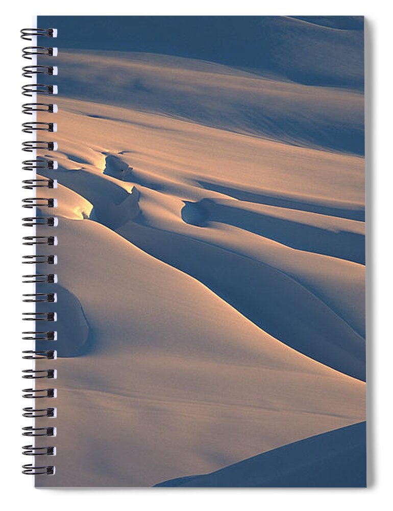 00260037 Spiral Notebook featuring the photograph Skier And Crevasse Patterns At Sunset by Colin Monteath
