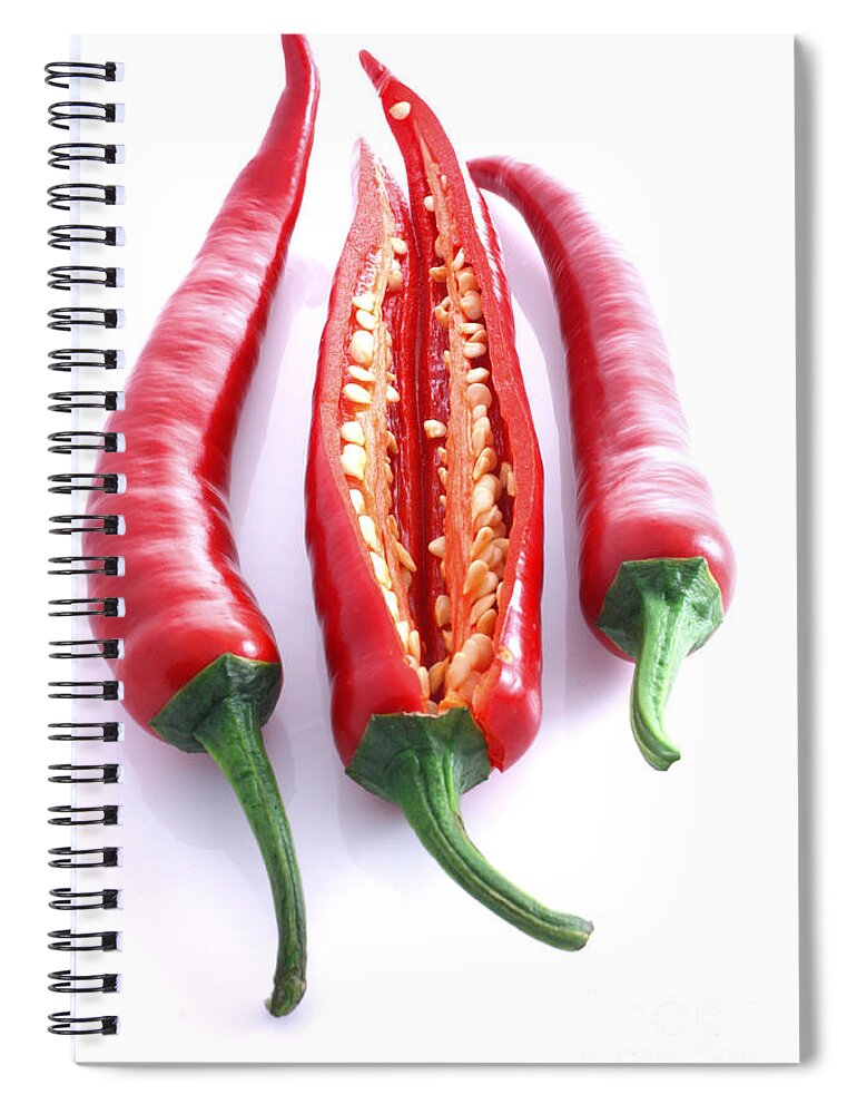 Seeds Spiral Notebook featuring the photograph Three red chilli's with one cut open by Simon Bratt