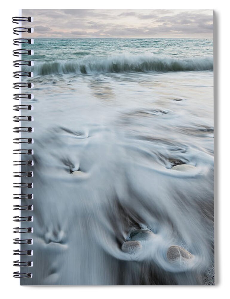 Coastline Spiral Notebook featuring the photograph Pebbles in the beach and flowing sea water by Michalakis Ppalis