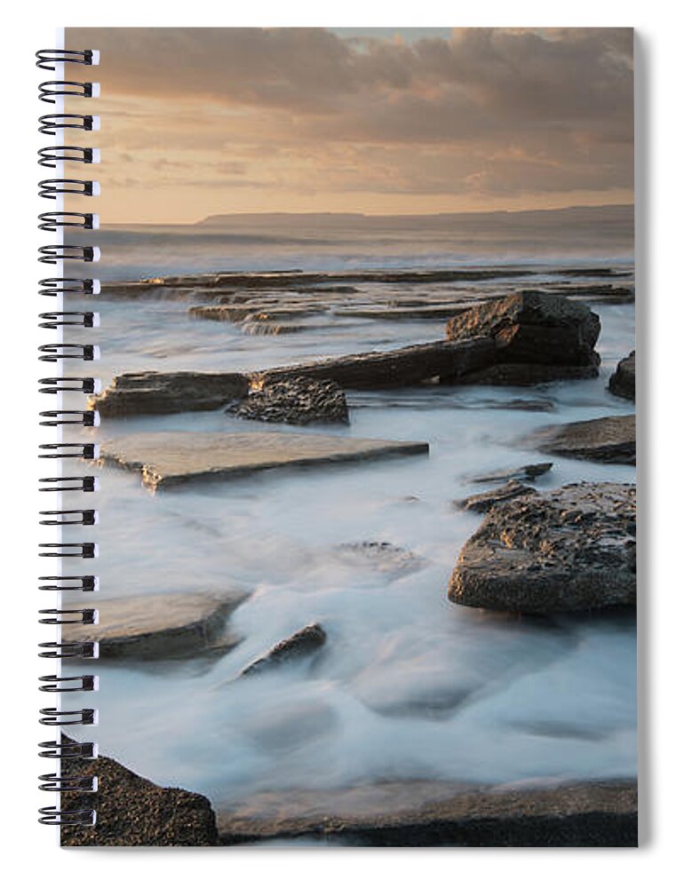Seascape Spiral Notebook featuring the photograph Rocky seashore seascape with wavy ocean during sunset #1 by Michalakis Ppalis