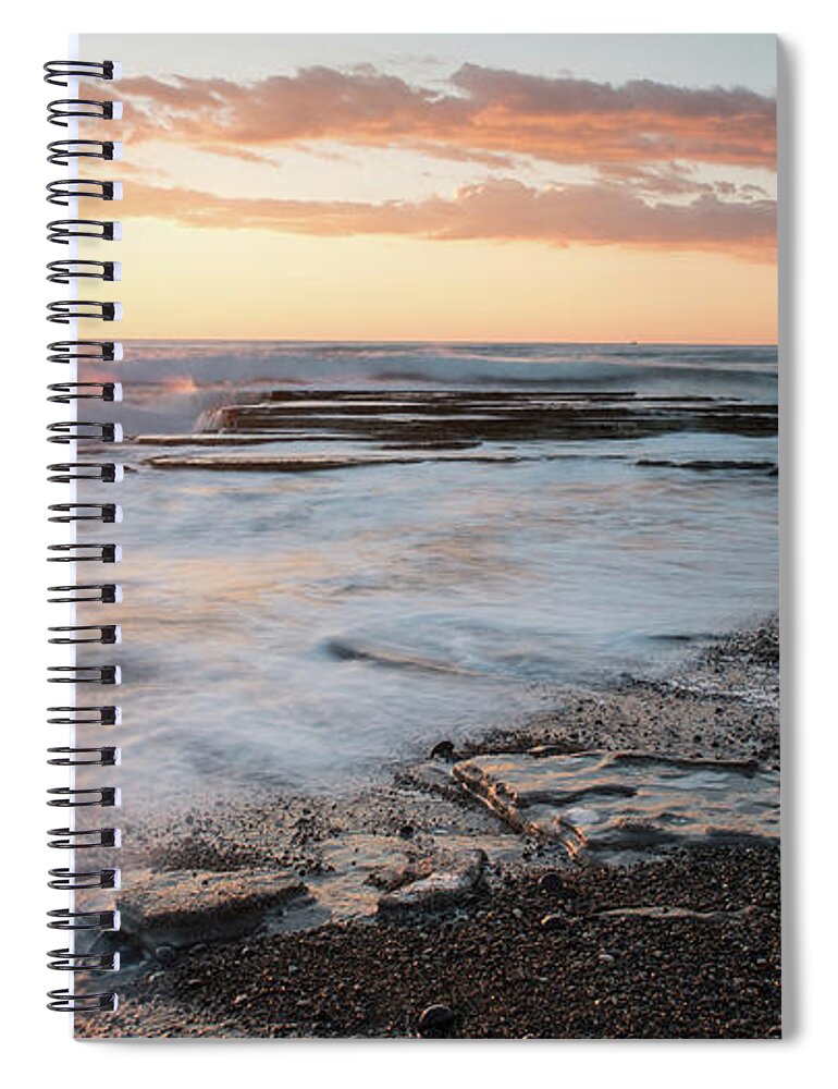 Seascape Spiral Notebook featuring the photograph Beautiful dramatic Sunset over a rocky coast by Michalakis Ppalis
