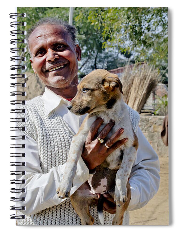 India Spiral Notebook featuring the photograph A man with a puppy at the roadside. by Elena Perelman
