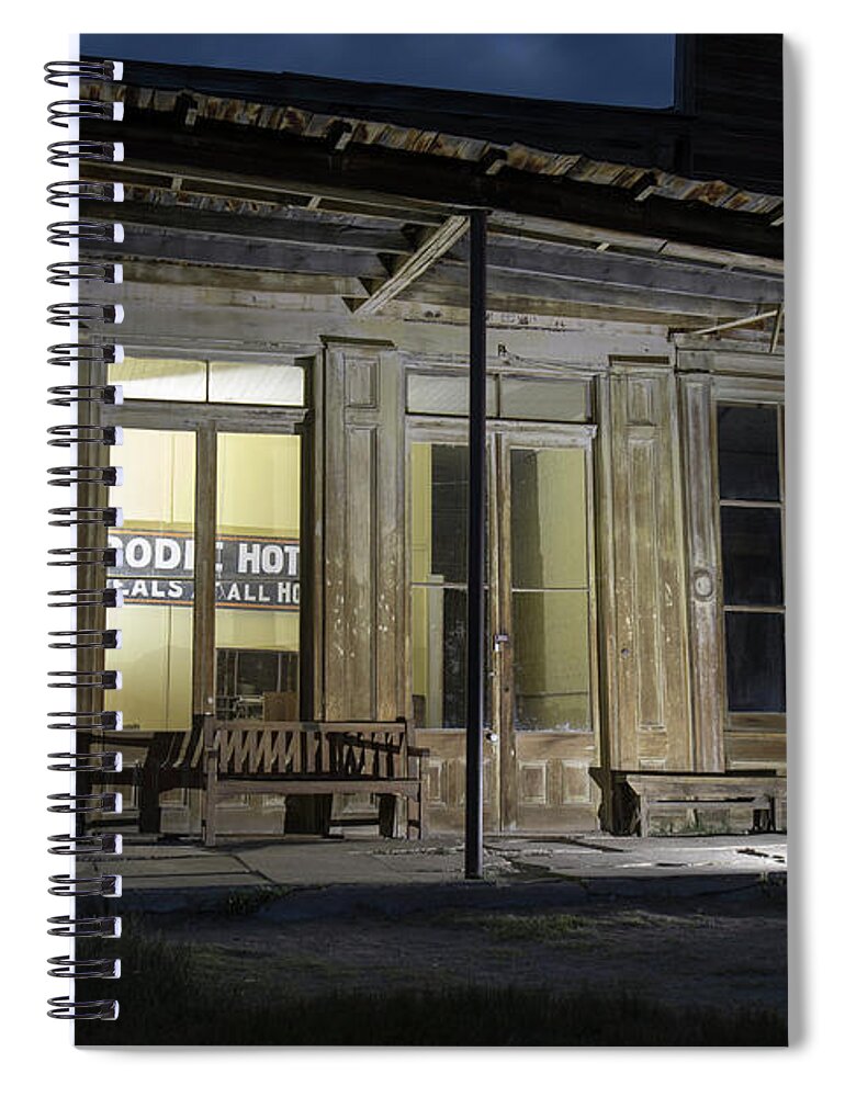 Abandoned Spiral Notebook featuring the photograph Bodie Hotel illuminated at night by Karen Foley