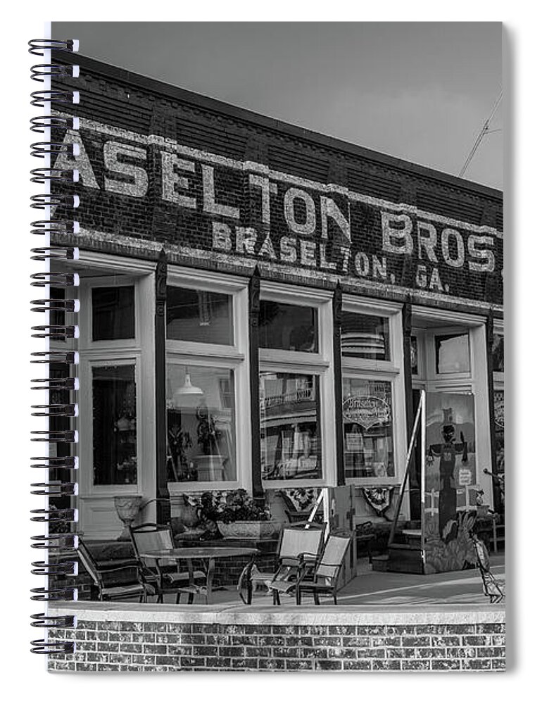 Braselton Spiral Notebook featuring the photograph Braselton Bros Inc. Store Front in BW by Doug Camara