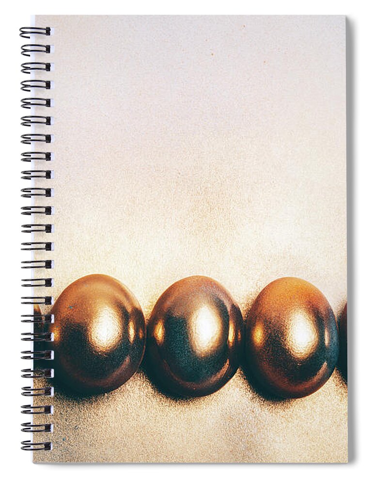 Egg Spiral Notebook featuring the photograph Five golden eggs laying on the floor. by Michal Bednarek