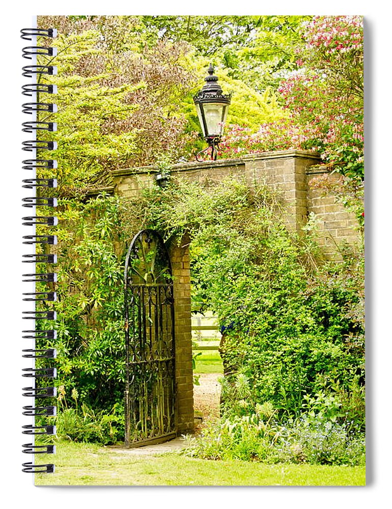 Garden Wall Spiral Notebook featuring the photograph Garden Wall With Iron Gate And Lantern. by Elena Perelman