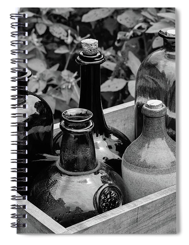 Antique Spiral Notebook featuring the photograph Glass Bottles in the Garden by Nicole Lloyd