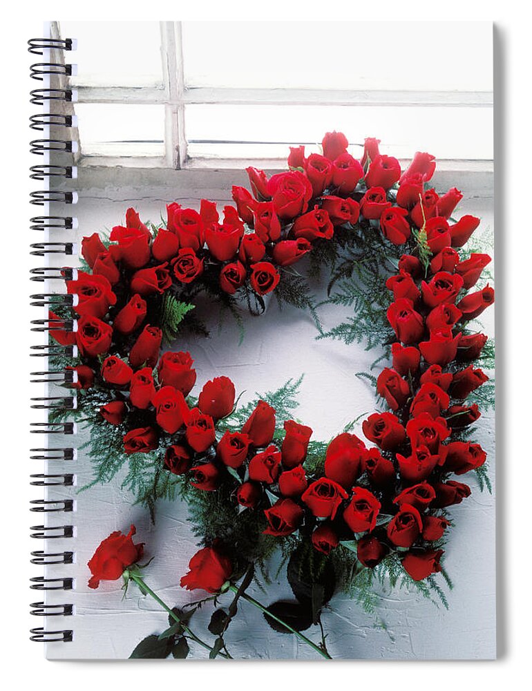 Red Spiral Notebook featuring the photograph Heart shape made of roses by Garry Gay
