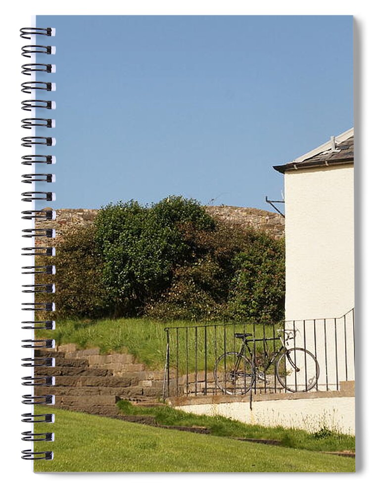 House On The Slope Spiral Notebook featuring the photograph House on the slope with a bike and a lamppost. by Elena Perelman