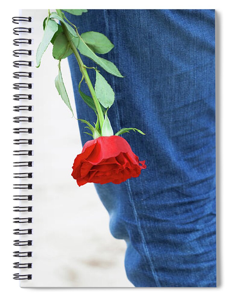 Love Spiral Notebook featuring the photograph Man with a rose behind his back waiting for love. Romantic date on the beach by Michal Bednarek