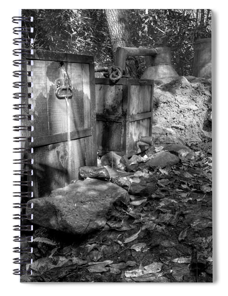 Moonshine Spiral Notebook featuring the photograph North Carolina Moonshine Still in Black and White by Greg and Chrystal Mimbs