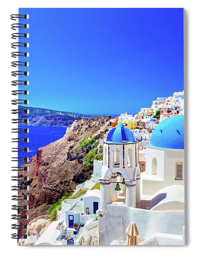 Santorini Spiral Notebook featuring the photograph Oia town on Santorini island, Greece. Caldera on Aegean sea. by Michal Bednarek