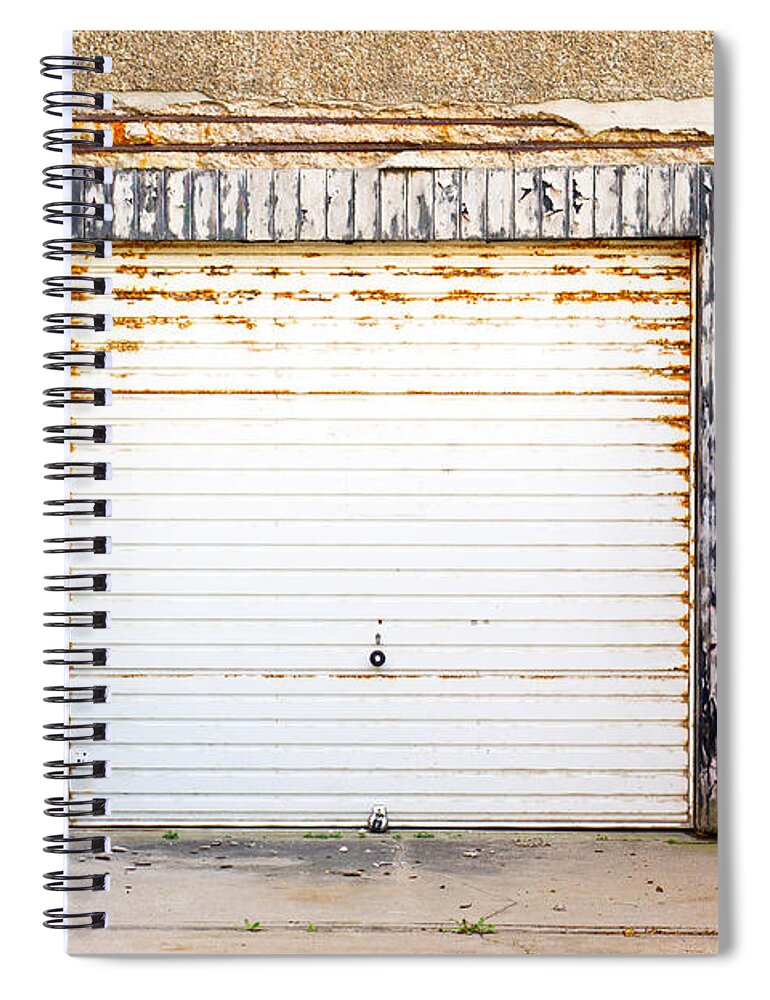 Abandoned Spiral Notebook featuring the photograph Old garage door by Tom Gowanlock