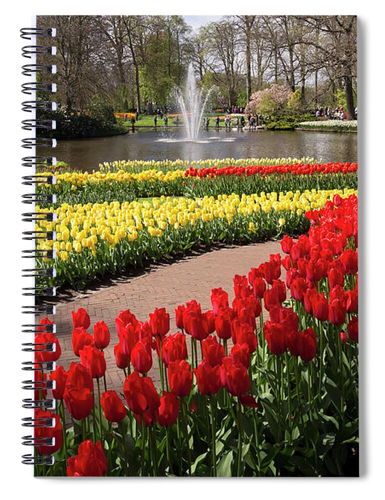 Red Spiral Notebook featuring the photograph Red and yellow tulips on the river bank in Keukenhof Gardens by Louise Heusinkveld