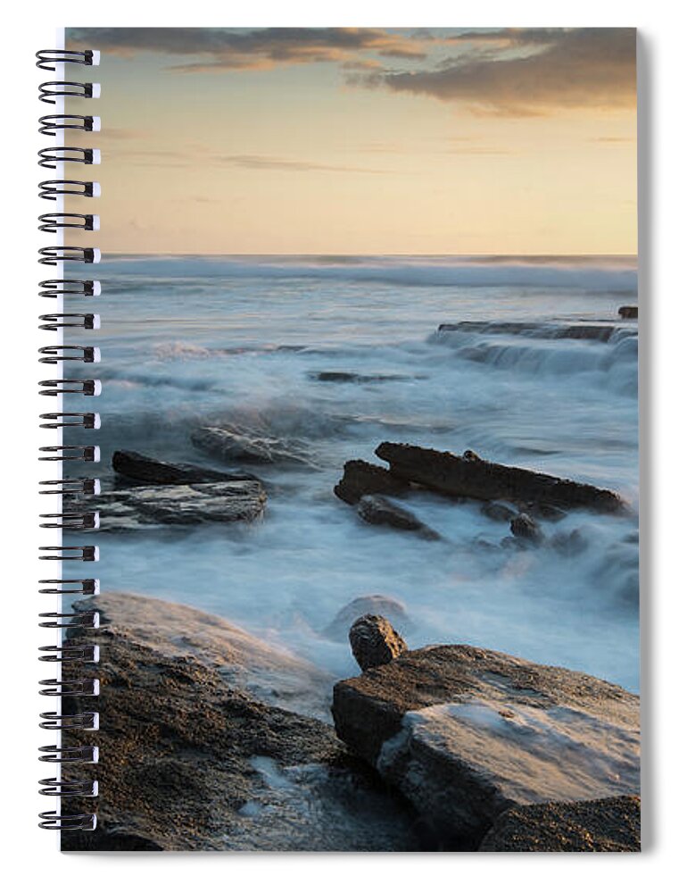 Sea Spiral Notebook featuring the photograph Rocky seashore during sunset by Michalakis Ppalis