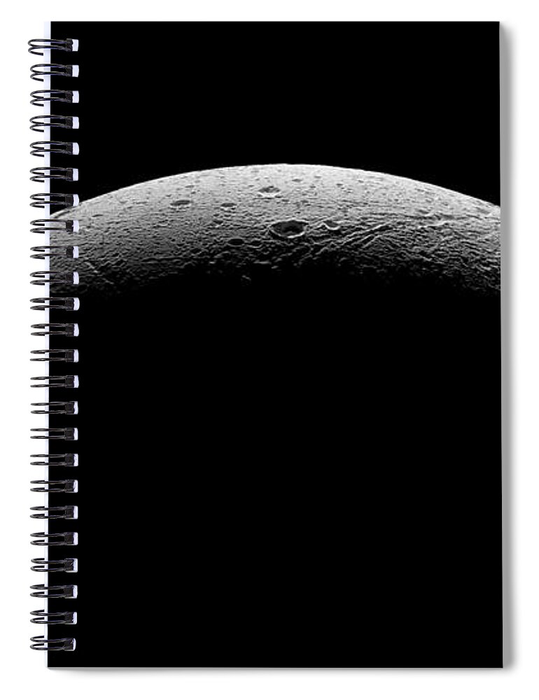 Astronomical Spiral Notebook featuring the photograph Saturn's moon Dione by Nasa