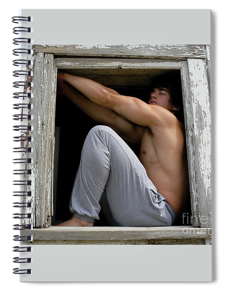 Young Spiral Notebook featuring the photograph Handsome young man poses seductively in a broken down barn window. by Gunther Allen