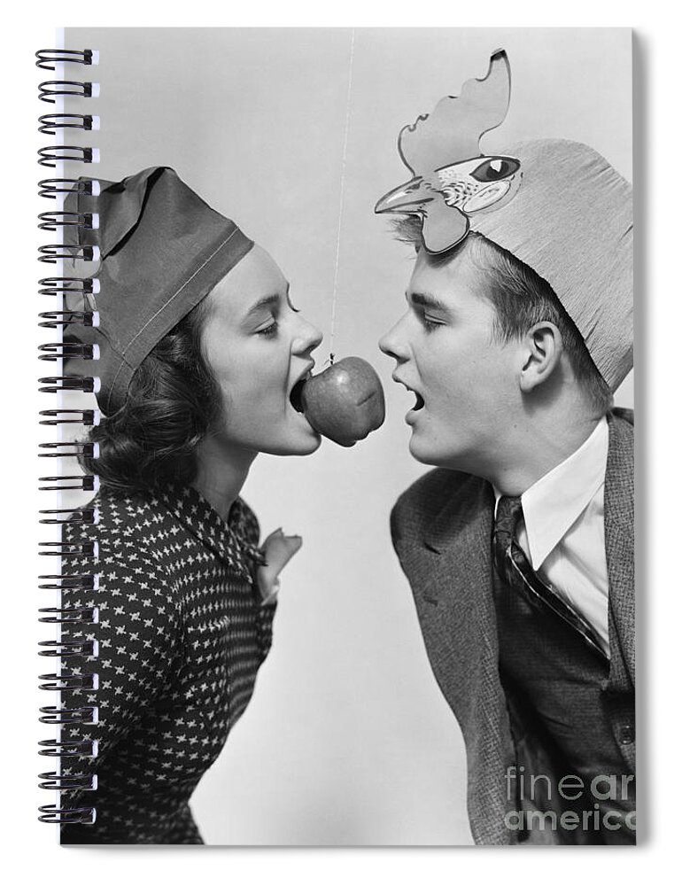 1940s Spiral Notebook featuring the photograph Teen Girl And Boy Bobbing For Apple by H. Armstrong Roberts/ClassicStock