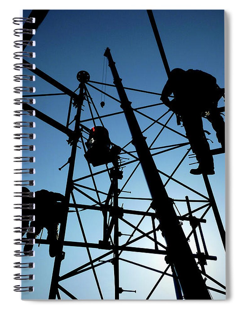 Tower Steel Climbing Safety Rescue Blue Silhouette Sun Crane Boom Communications Cell Cellular Antenna Beacon Black Workers Cellphones Fall Protection Osha Rigging Heights Tower Technician Rope Work Ropes Aerial High Harness Spiral Notebook featuring the photograph Tower Tech by Bob Geary