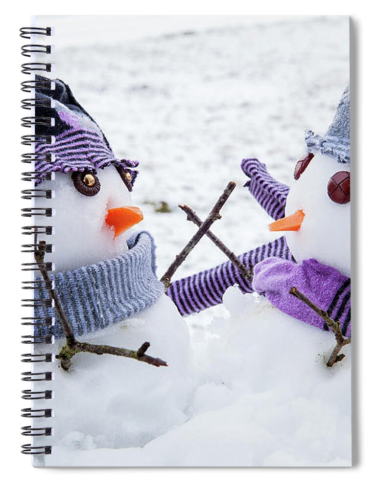 Snowmen Spiral Notebook featuring the photograph Two cute snowmen friends embracing by Simon Bratt