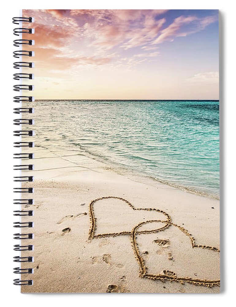 Heart Spiral Notebook featuring the photograph Two hearts drawn on a sandy beach by the sea. by Michal Bednarek