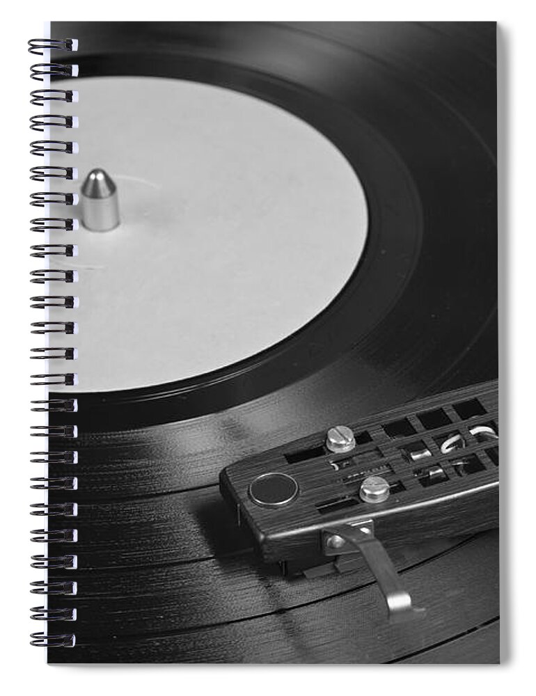 Vinyl Record Spiral Notebook featuring the photograph Vinyl Record Playing on a Turntable Overview by Angelo DeVal
