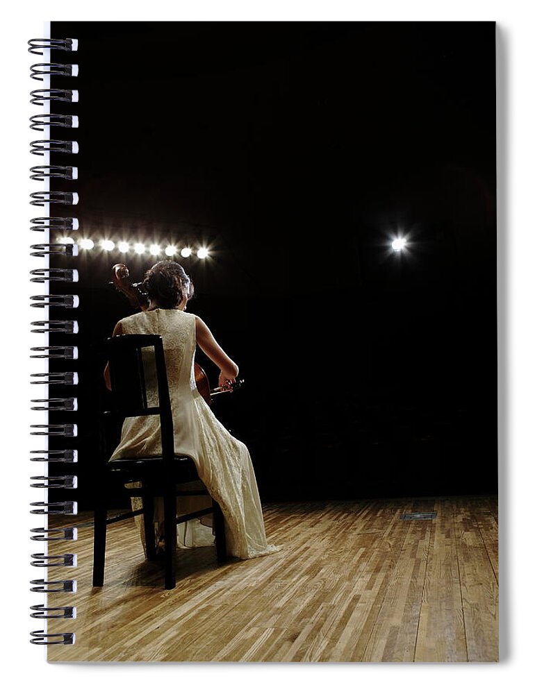 Mature Adult Spiral Notebook featuring the photograph A Female Cellist Playing Cello On #2 by Sot