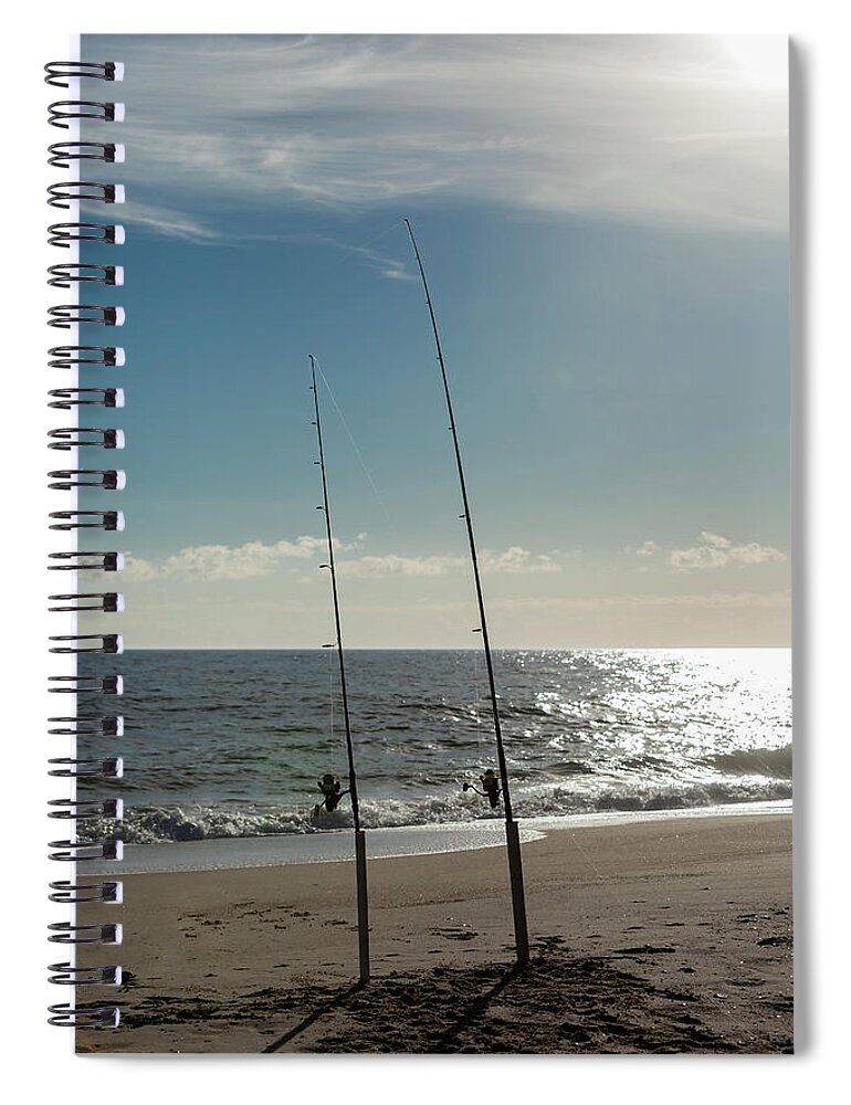 2 Fishing Poles in the sand waiting to play Spiral Notebook