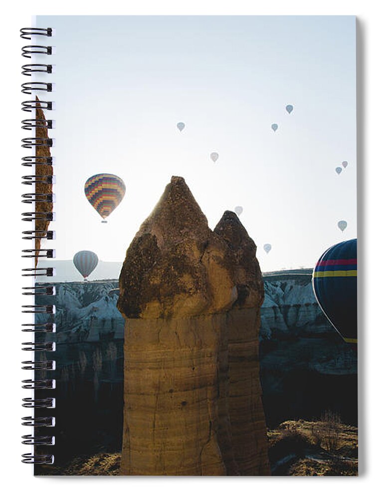 Adventure Spiral Notebook featuring the photograph hot air balloons for tourists flying over rock formations at sunrise in the valley of Cappadocia. #4 by Joaquin Corbalan