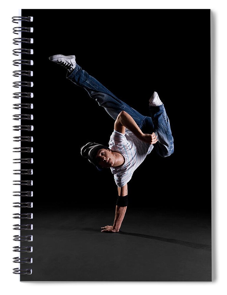 Expertise Spiral Notebook featuring the photograph A B-boy Doing A K-kick Breakdance Move by Halfdark