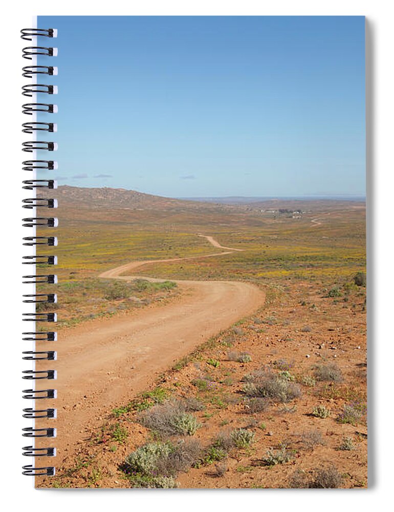 Outdoors Spiral Notebook featuring the photograph A Dirt Road Winds Through The Barren by Anthony Grote