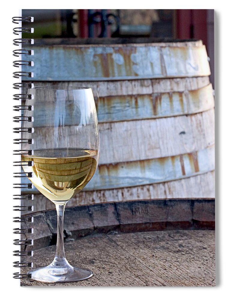 Alcohol Spiral Notebook featuring the photograph A Glass Of Chardonnay Sitting On A by Swalls