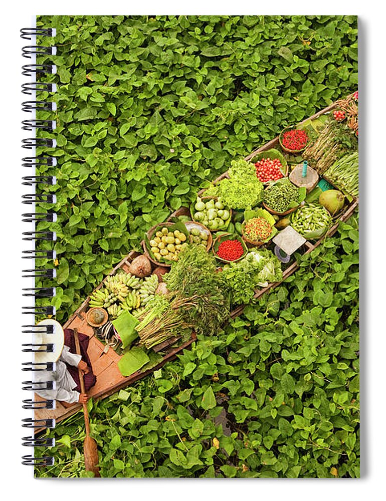 Trading Spiral Notebook featuring the photograph A Longboat Or Dug Out Canoe, Laden With by Mint Images - Art Wolfe